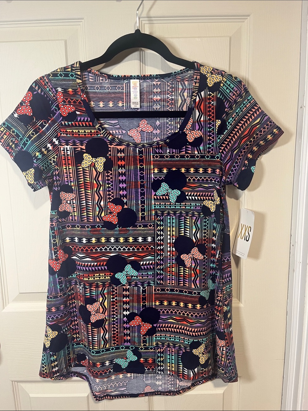 LuLaRoe Navy Short Sleeve Tee with Multicolor Bow & Geometric Print